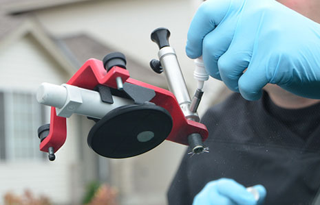 Certified technician performing mobile windshield repair in Seattle